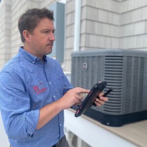 Employee performing inspection of home by JS Pro Property Management.